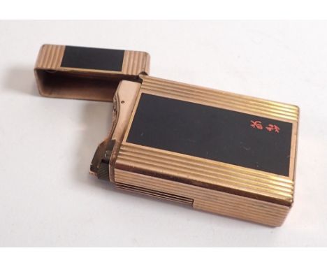 A Dupont gold plated lighter with Chinese script 
