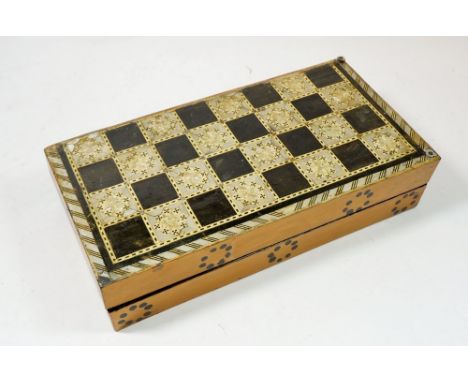 A late 19th century Moroccan style mother of pearl inlaid games box with chess board top and backgammon interior -&nbsp;Open 