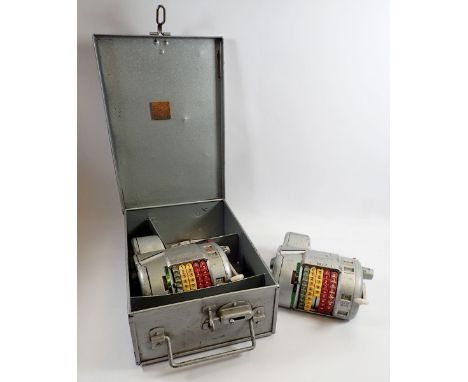 Two Almex bus conductor ticket machines, one in metal case 