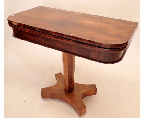 A Victorian rosewood fold top card table with baize interior 
