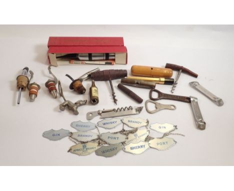 A collection of Breweriana items including decanter labels, Guinness bottle openers, miniature Haig's whisky bottle corkscrew