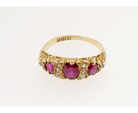 A Victorian 18 carat gold ruby and diamond ring the three rubies interspersed with eight old cut diamonds, size O 3.8g 