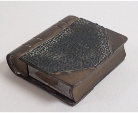 A novelty book form cigarette lighter 