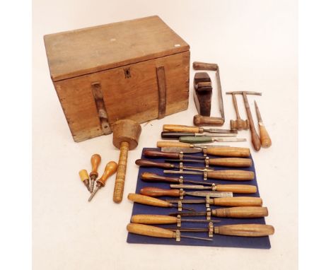 A pine woodworkers chest containing various tools including a set of chisels by C Hill 
