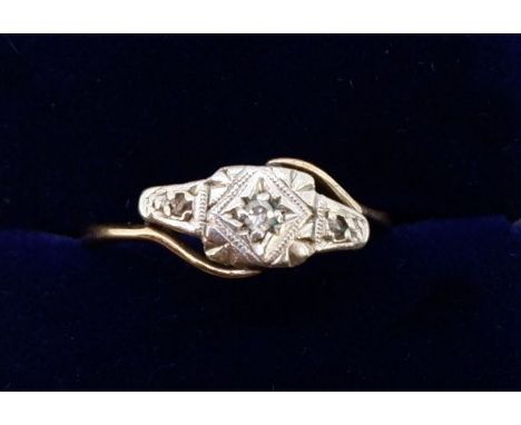 An Edwardian 9 carat gold and platinum ring illusion set chip diamonds, 2.8g, size O 