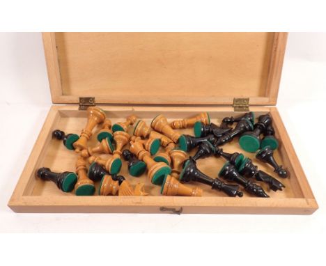 A wooden chess set with chessboard form box 