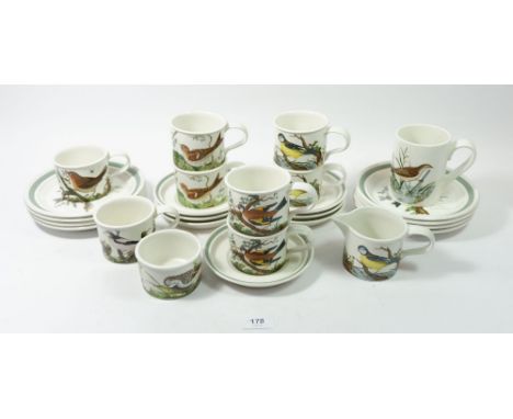 A set of eight Portmerion Birds cups and seven saucers, sugar, milk jug and eight tea plates 