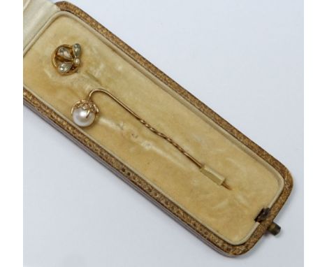 An Edwardian gold stick pin set citrines and seed pearl in original box and a yellow metal and pearl stick pin 