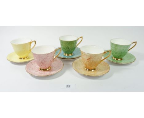 A Royal Albert harlequin part set of five cups and saucers 