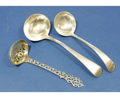 A Victorian silver sifter spoon with pierced decoration, Birmingham 1854 by Hilliard &amp; Thompson, a sauce ladle, London 18