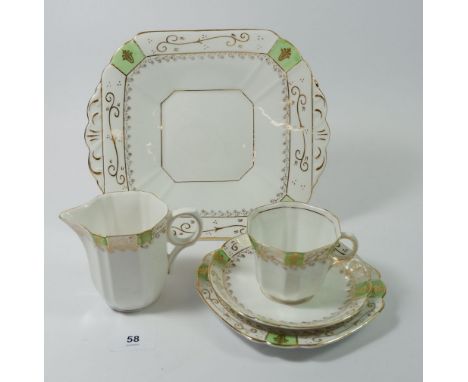 A Melba Edwardian tea service comprising six cups and saucers, six tea plates, cake plate and jug 