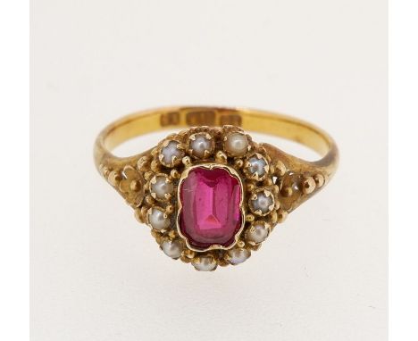 A Victorian 15 carat gold ruby and pearl cluster ring, size M/N, cluster 1cm diameter, 2.5g 