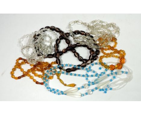 Six glass crystal necklaces and one ceramic one 