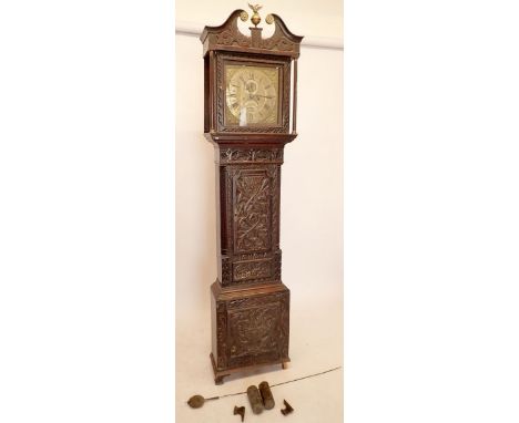 An 18th century oak longcase clock with brass dial by Henry Deykin, Worcester, with all over carved decoration, eight day mov