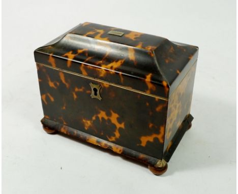 A 19th century small tortoiseshell tea caddy with two caddies within and ball feet, 13.5 x 8 x 12cm