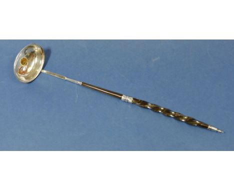 A Georgian silver horn handled punch ladle inset George III third guinea 1810 to base, not marked 