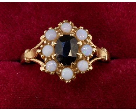A 14 carat gold opal and garnet cluster ring, size U, 3.2g 