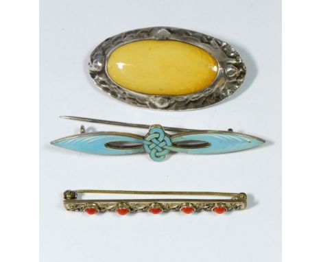 A silver and enamel Marius Hammer brooch, 6.5cm, a white metal Arts &amp; Crafts style brooch inset Ruskin style yellow plaqu
