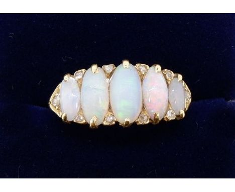 A Victorian gold five stone opal ring interspersed with small diamonds, size M to N, 5g 