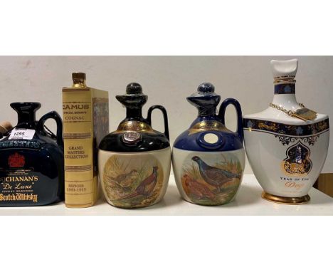 Mixed spirits and others. Rutherford whisky (2 jugs), Buchanon jug, Famous Grouse jug, Camus Cognac ceramic 'book' flask, Boo