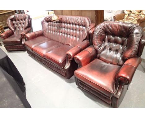 Red leather button back three piece suite in good condition 