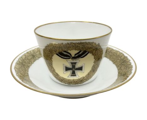 WW2 Nymphenburg cups and saucer, decorated with Imperial German Iron Cross encircled in a foliate boarder with gilt edging, w