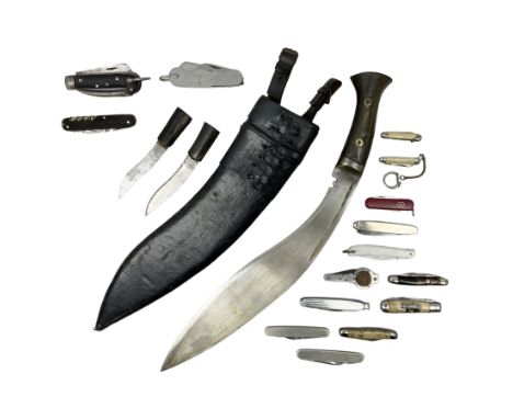 WW2 Gurkha Kukri knife with 34cm curving steel blade and horn handle; in leather covered scabbard with dual belt loops and tw
