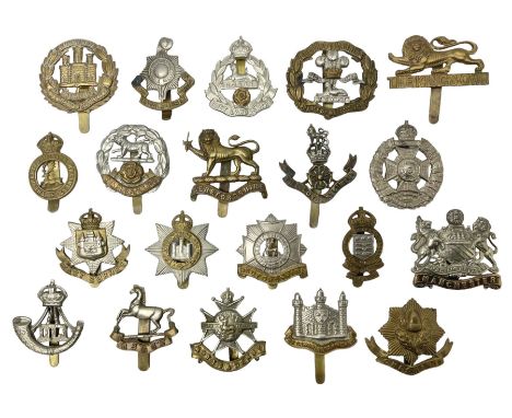 Twenty cap badges including Hertfordshire, Royal Sussex, Cambridgeshire, Hampshire, Notts and Derby, East Surrey, Herefordshi