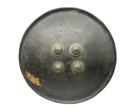 Indian black lacquered hide shield/dhal, of circular convex form with strongly outward-turned brim, fitted at its centre with