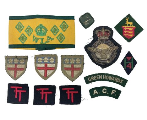 WW2 Women's Land Army six-year service armband in yellow and green; and small quantity of cloth badges including RAF blazer b