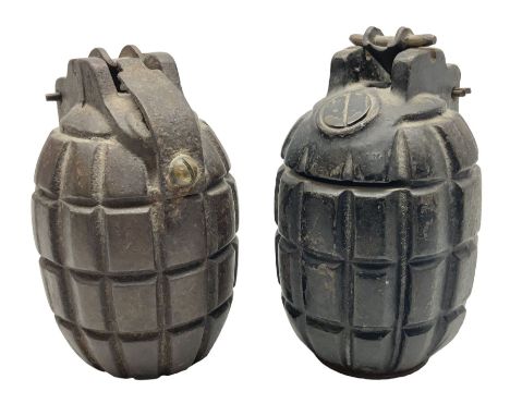 Two inert WW2 Mills Bomb (pineapple) hand grenades; one adapted as a money box with coin slit to the side and later cap H9.5c