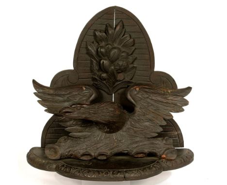 A CARVED WOOD EAGLE BRACKET AND SHELF, 41CM H, LATE 19TH C, BLACK PAINTED 