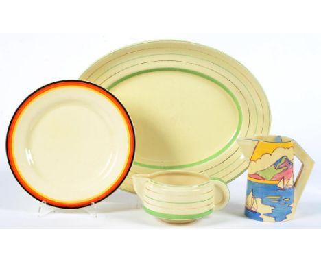 CLARICE CLIFF. AN A. J. WILKINSON GIBRALTAR JUG, 13CM H, PRINTED MARKS, C1931 AND A CLARICE CLIFF GRAVY JUG, DINNER PLATE AND