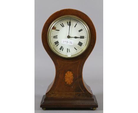 A Victorian inlaid mahogany balloon shaped mantel clock with enamel dial, Roman numeral markers and eight day movement.