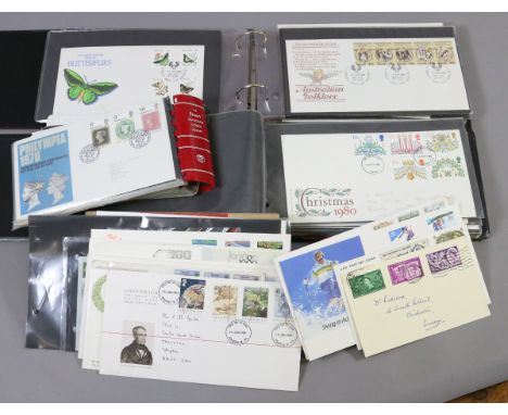 A box containing stamp albums and First Day Covers.
