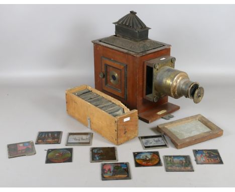 A converted Victorian magic lantern and collection of religious painted glass slides.