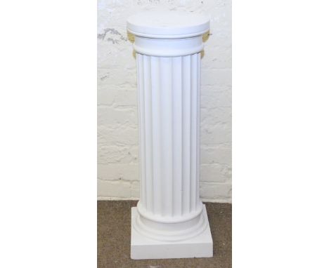 A painted plantstand formed as a column.