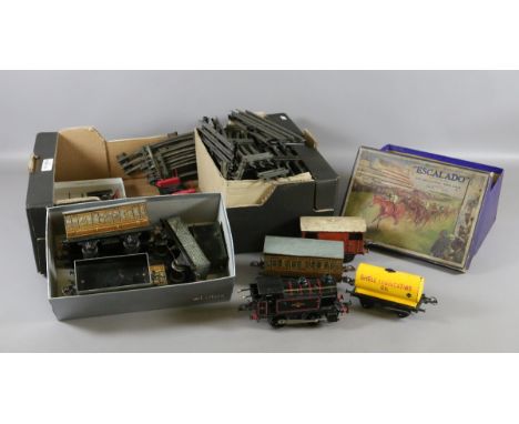 A box of 'O' gauge Meccano to include track, rolling stock, and engine along with a boxed Escalado mechanical race game.