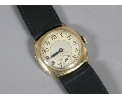 A vintage 9ct gold cased manual wristwatch on leather strap with applied stylized Arabic numeral markers and subsidiary secon