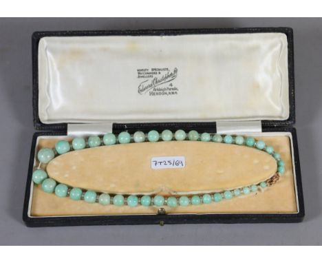 A cased vintage Chinese jade necklace.