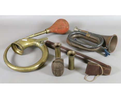 A brass car horn, copper bugle, a pair of trench art shell cases, British army hand grenade case and a leather batton holder.