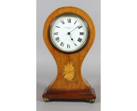 A Victorian mahogany balloon mantel clock with marquetry inlay and housing a French thirty hour movement with platform escape