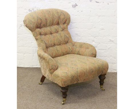 A Victorian oak and deep button upholstered nursing chair.