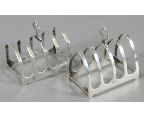 Two silver George VI five bar toastracks. Assayed Sheffield 1938, 104 grams. 