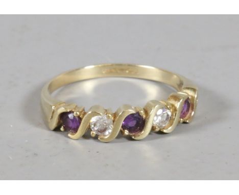 A 9ct gold ring set with paste stones and amethyst, size R.