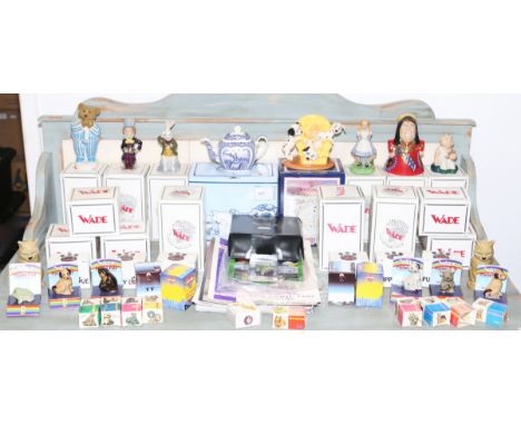 A good collection of Wade ceramic figures to include Whimsies and boxed collectors club examples, etc.