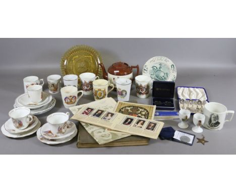 A collection of commemorative wares and ephemera to include cased flatwares, coins, cigarette cards in album and various cera