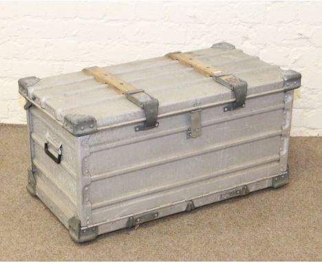 A metal trunk and contents of waterproof clothing and footware.