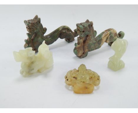 A Chinese jade carving of a dragon, 5cm diameter, jadeite carving of a dragon and a fish, and a pair of jade elongated dragon