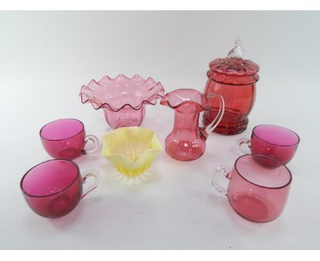 A Victorian cranberry glass jar and cover, sweetmeat dish, jug and four cups, together with opaline glass bowl, (8).